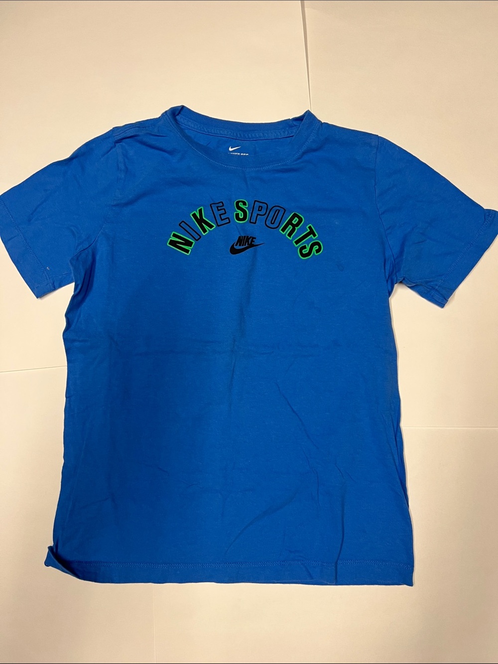 Nike Blue Short Sleeve Tee with Green-Outlined 'NIKE SPORTS' Graphic